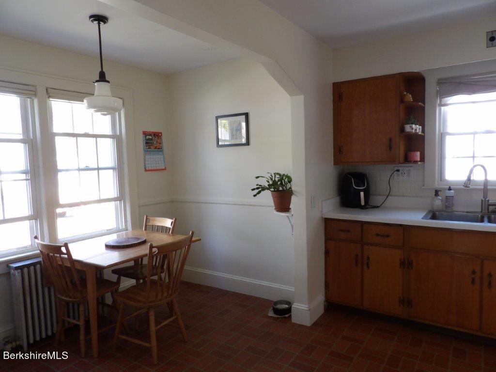 64 Cleveland Street Pittsfield, MA 01201 - Photo 8 of 32 a view of a dining room with furniture and window