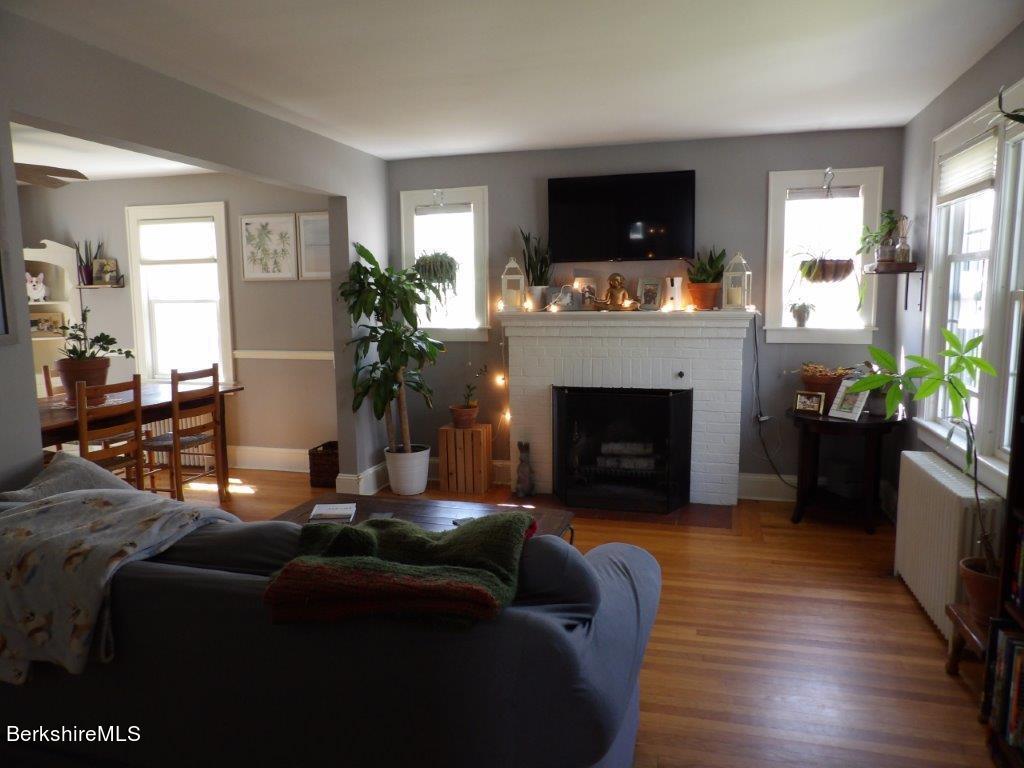 64 Cleveland Street Pittsfield, MA 01201 - Photo 9 of 32 a living room with furniture fireplace and flat screen tv
