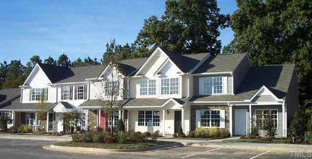 3637 Bison Hill Lane Raleigh, NC 27604 - Photo 5 of 10 a front view of a residential apartment building with a yard