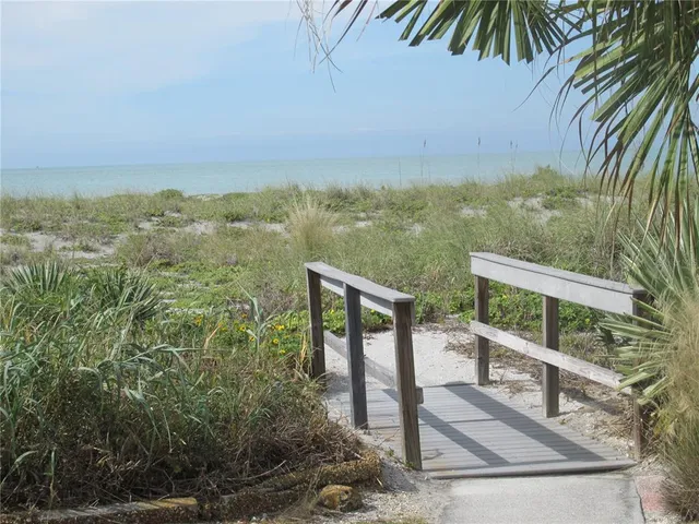a view of a balcony with an ocean view