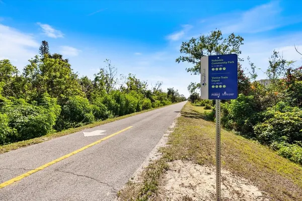 a view of a pathway along the garden