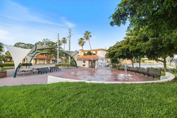 an aerial view of a house with swimming pool patio and outdoor seating