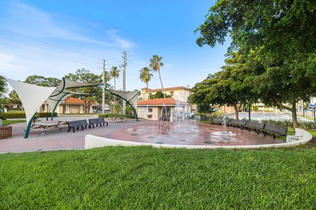 an aerial view of a house with swimming pool patio and outdoor seating