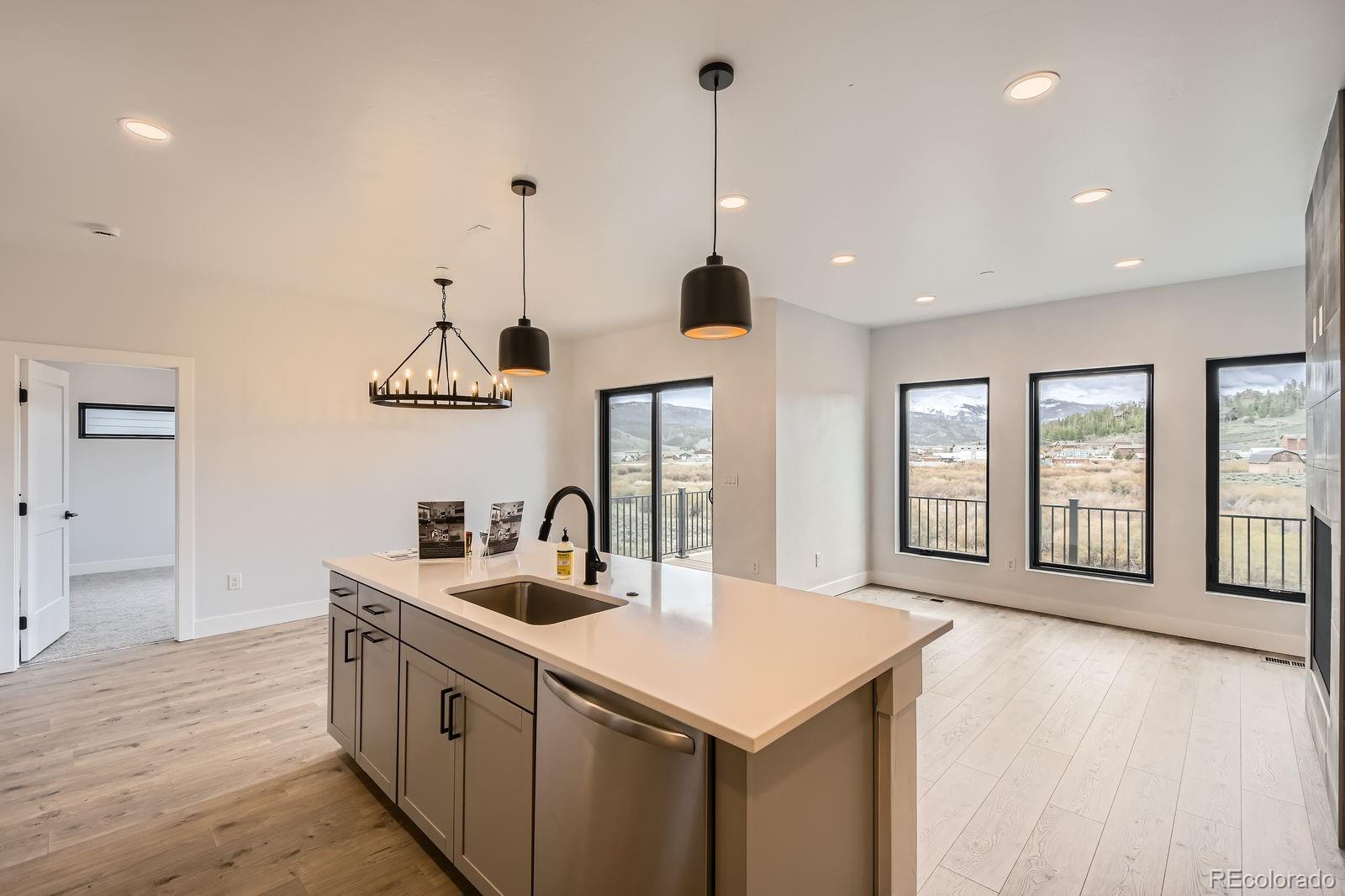 1501 James Drive Tabernash, CO 80478 - Photo 6 of 25 a kitchen with counter top space and a sink