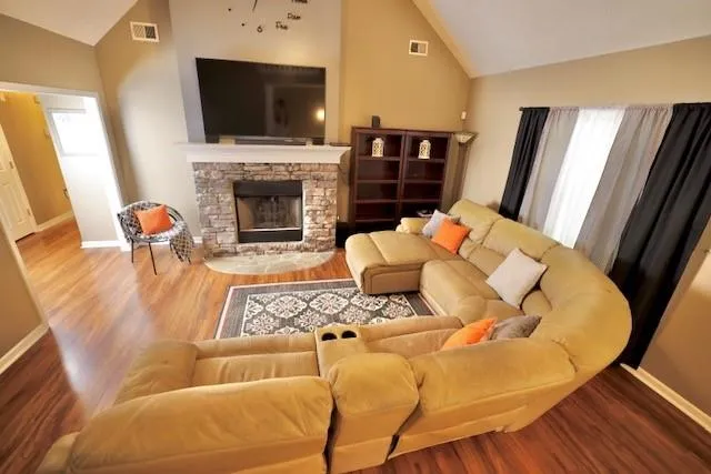 a living room with furniture fireplace and a flat screen tv
