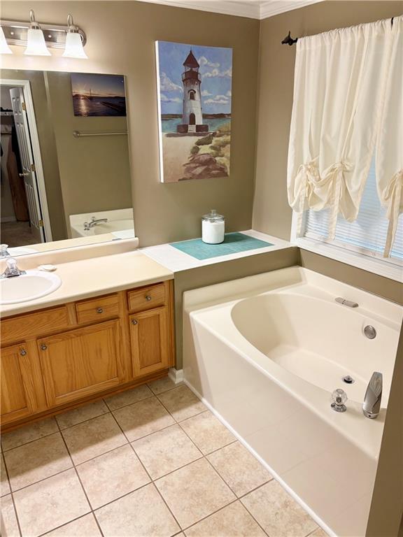 50 Butler Bridge Circle Covington, GA 30016 - Photo 7 of 12 a bathroom with a tub sink and mirror