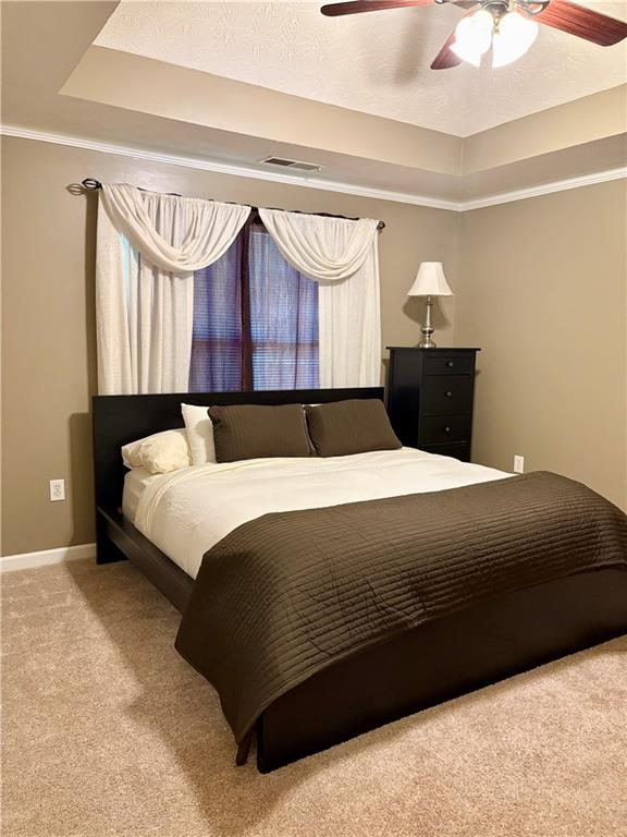 50 Butler Bridge Circle Covington, GA 30016 - Photo 9 of 12 a bedroom with a bed and window