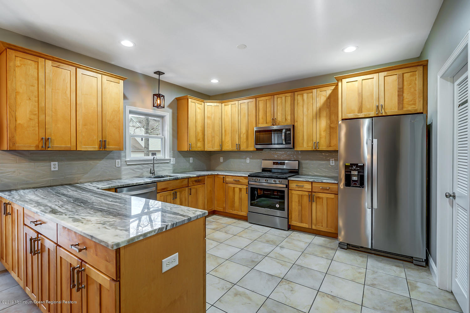 14 Stuyvesant Road Brick, NJ 08723 - Photo 2 of 32 a kitchen with stainless steel appliances granite countertop a refrigerator a oven a sink dishwasher and wooden cabinets with wooden floor