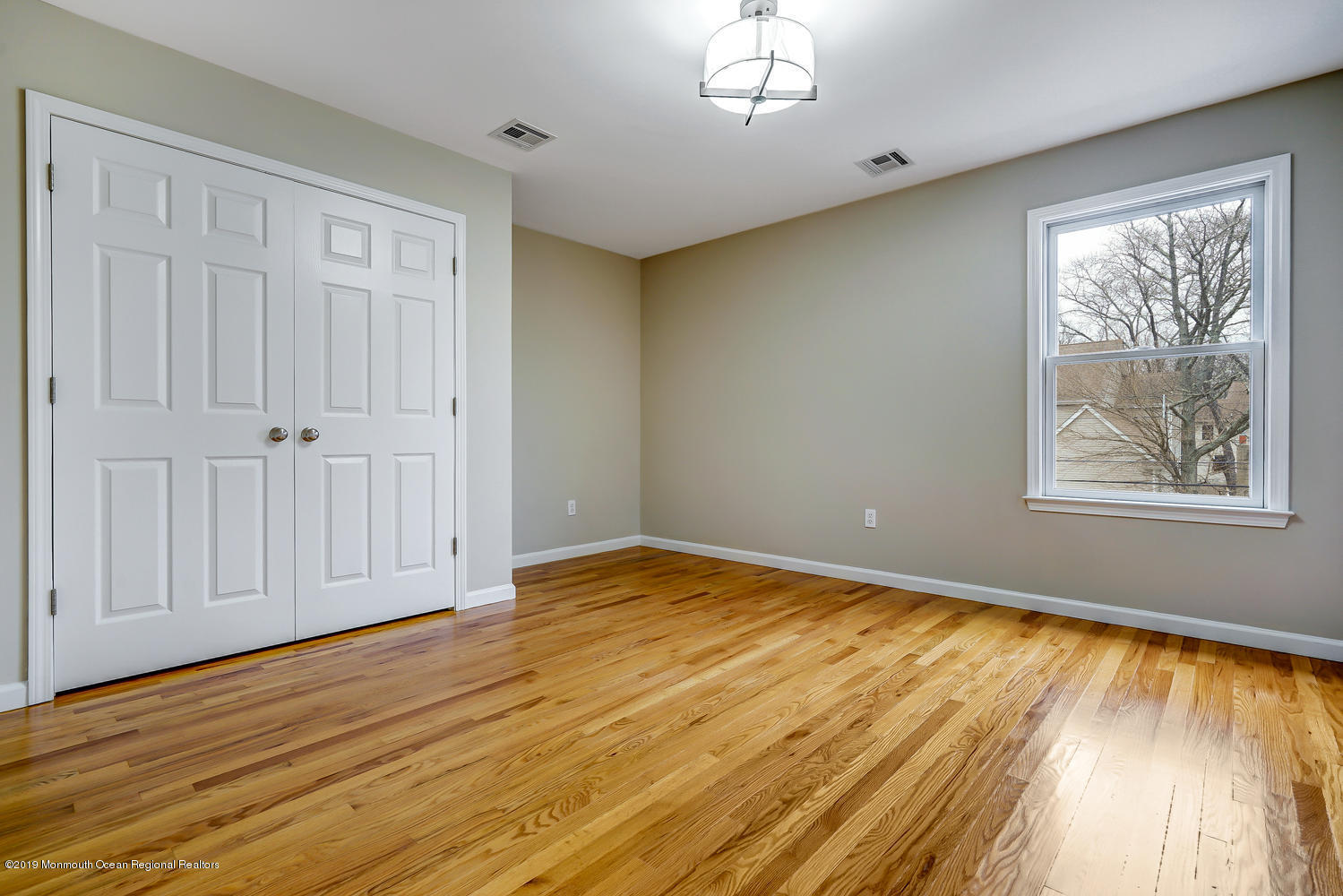 14 Stuyvesant Road Brick, NJ 08723 - Photo 24 of 32 a view of empty room with wooden floor and fan
