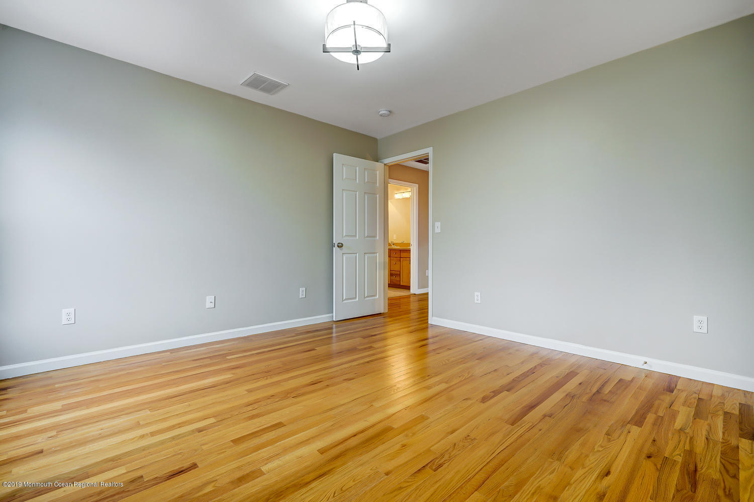 14 Stuyvesant Road Brick, NJ 08723 - Photo 25 of 32 a view of an empty room with wooden floor and a window