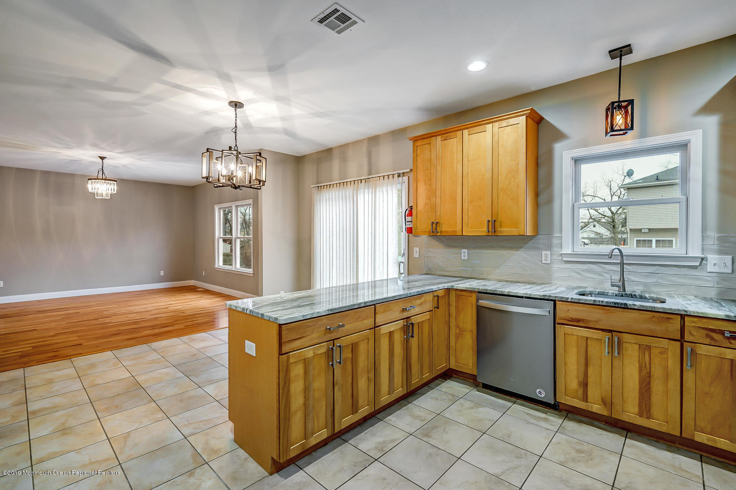 14 Stuyvesant Road Brick, NJ 08723 - Photo 4 of 32 a large kitchen with kitchen island a sink a counter top space and cabinets