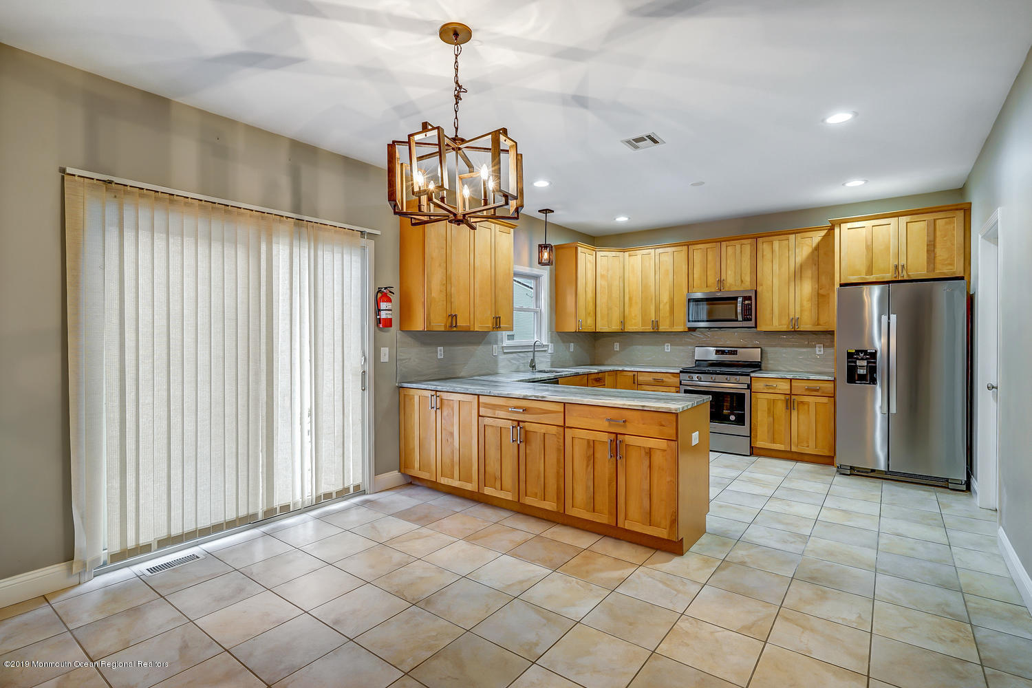 14 Stuyvesant Road Brick, NJ 08723 - Photo 6 of 32 a kitchen with stainless steel appliances granite countertop a stove a sink and a refrigerator