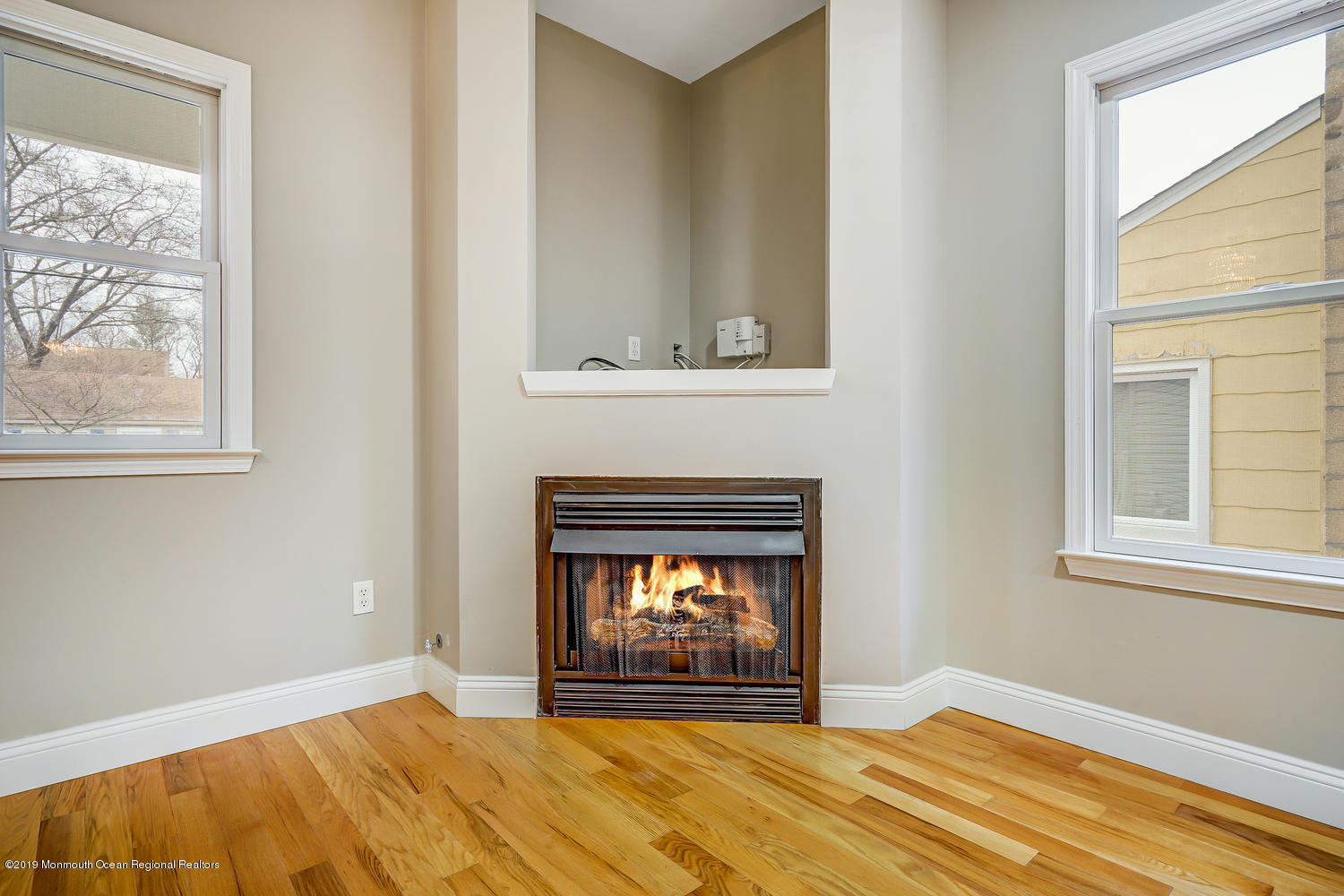 14 Stuyvesant Road Brick, NJ 08723 - Photo 9 of 32 a view of an empty room with a window and fireplace