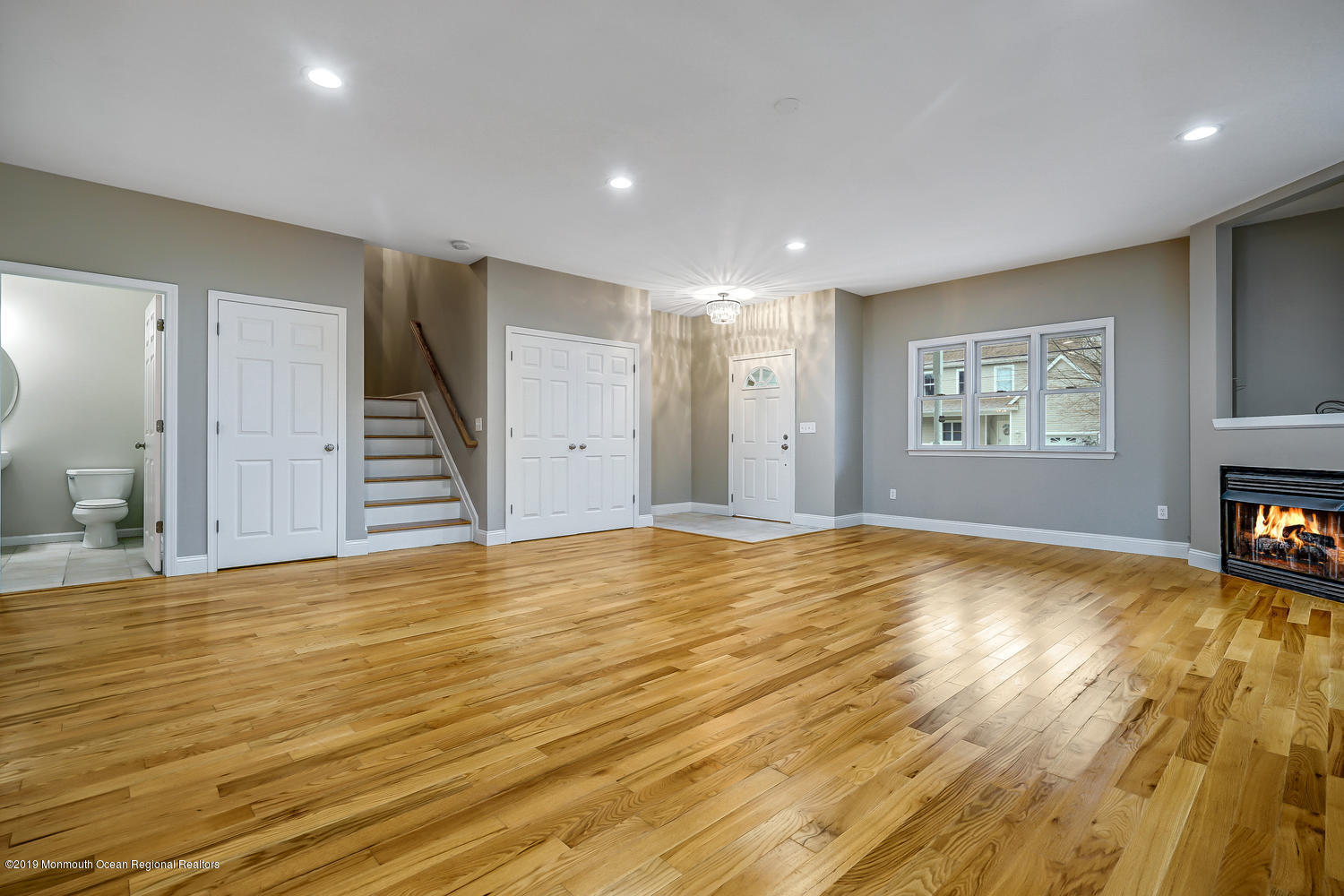 14 Stuyvesant Road Brick, NJ 08723 - Photo 10 of 32 a view of an empty room with wooden floor and a window