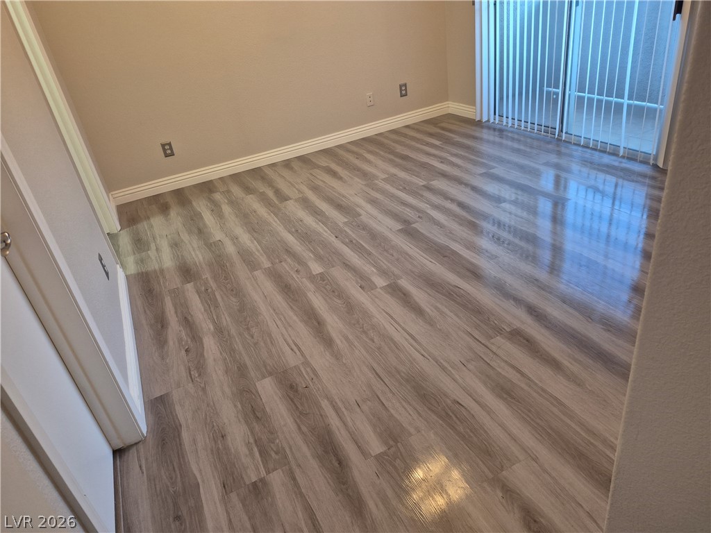 2053 Quarry Ridge Street, Unit 201 Las Vegas, NV 89117 - Photo 11 of 21 Luminous wood-look flooring extends through this tranquil interior space.
