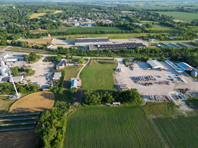 an aerial view of a house with a lake view