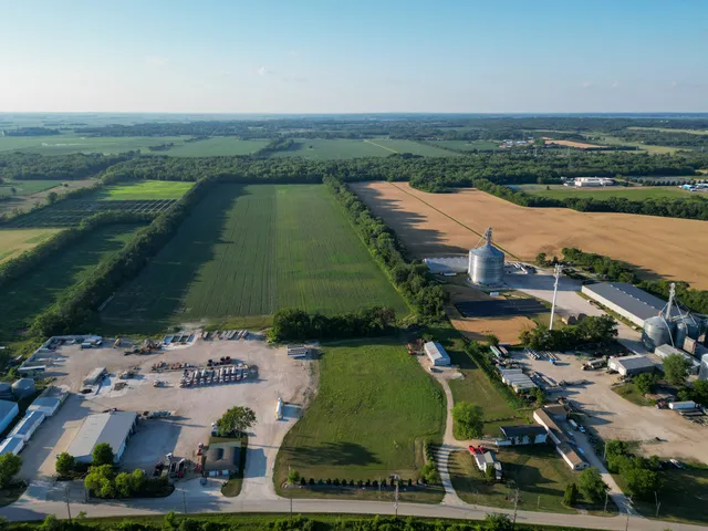 an aerial view of a house with a lake view