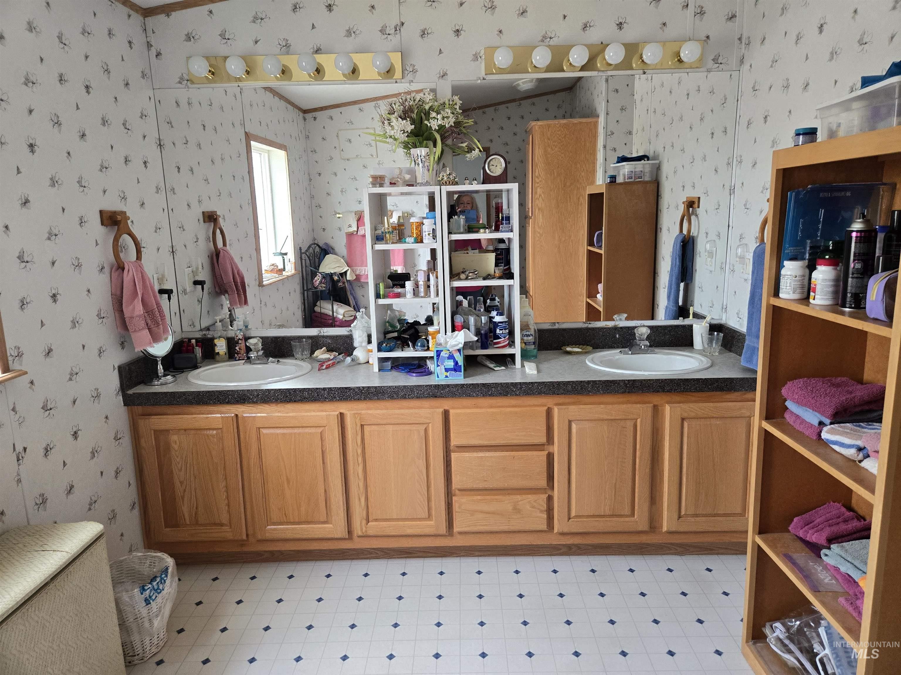 2750 Alden Road, Unit 37 Fruitland, ID 83619 - Photo 19 of 30 Bathroom featuring wallpapered walls, double vanity, crown molding, and tile patterned floors