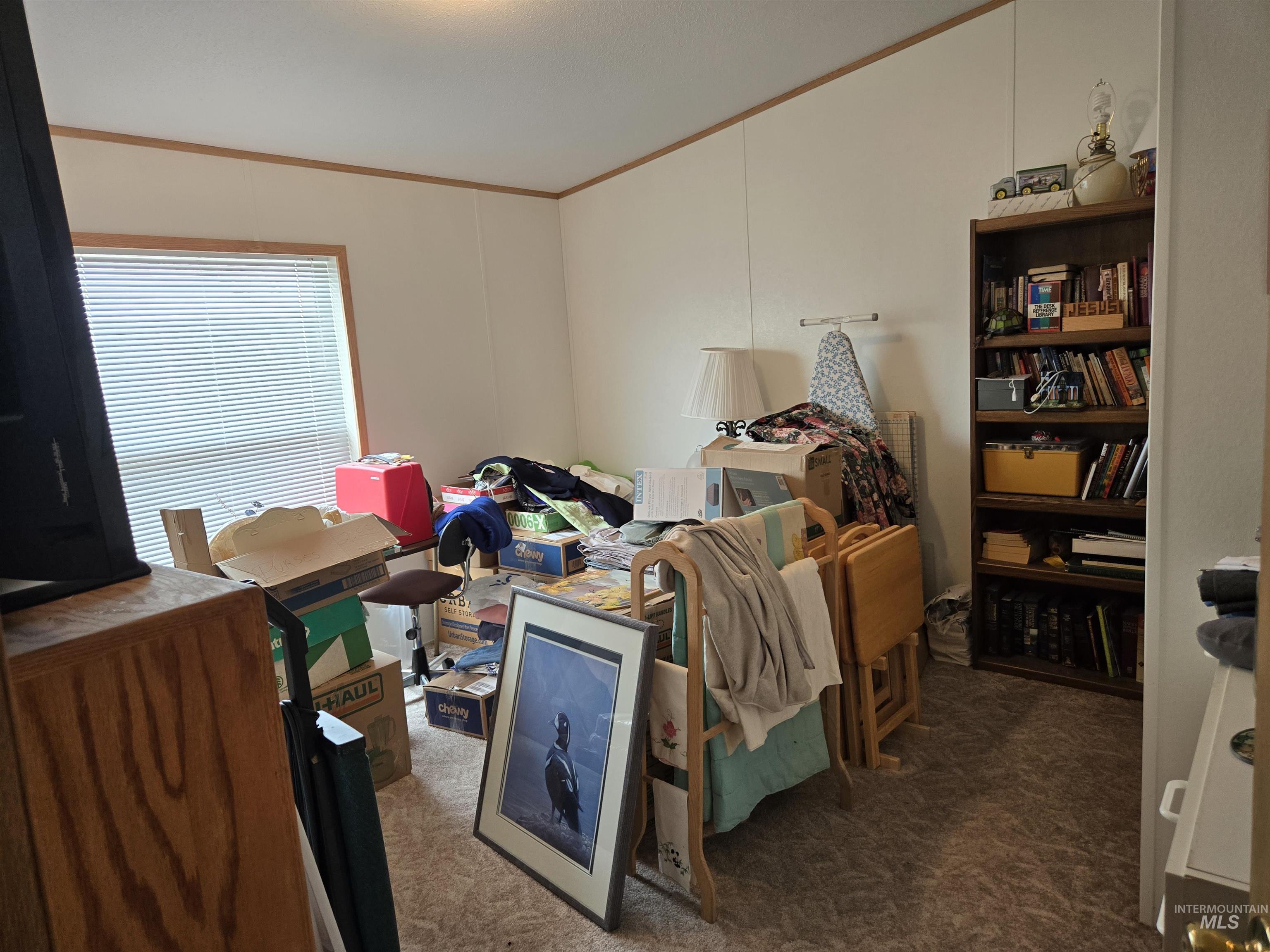 2750 Alden Road, Unit 37 Fruitland, ID 83619 - Photo 22 of 30 Carpeted bedroom featuring crown molding