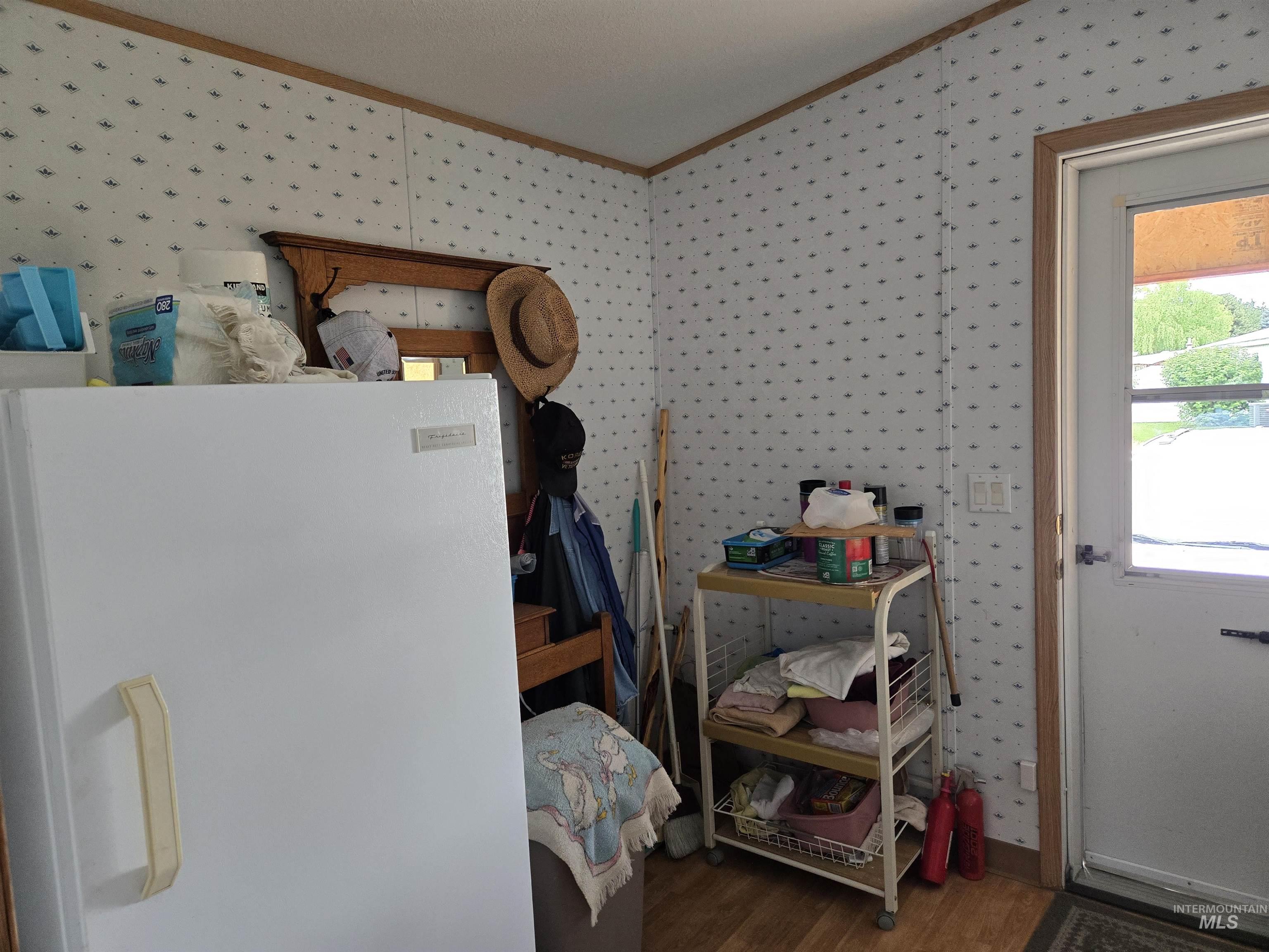 2750 Alden Road, Unit 37 Fruitland, ID 83619 - Photo 27 of 30 Miscellaneous room with ornamental molding, wallpapered walls, and wood finished floors