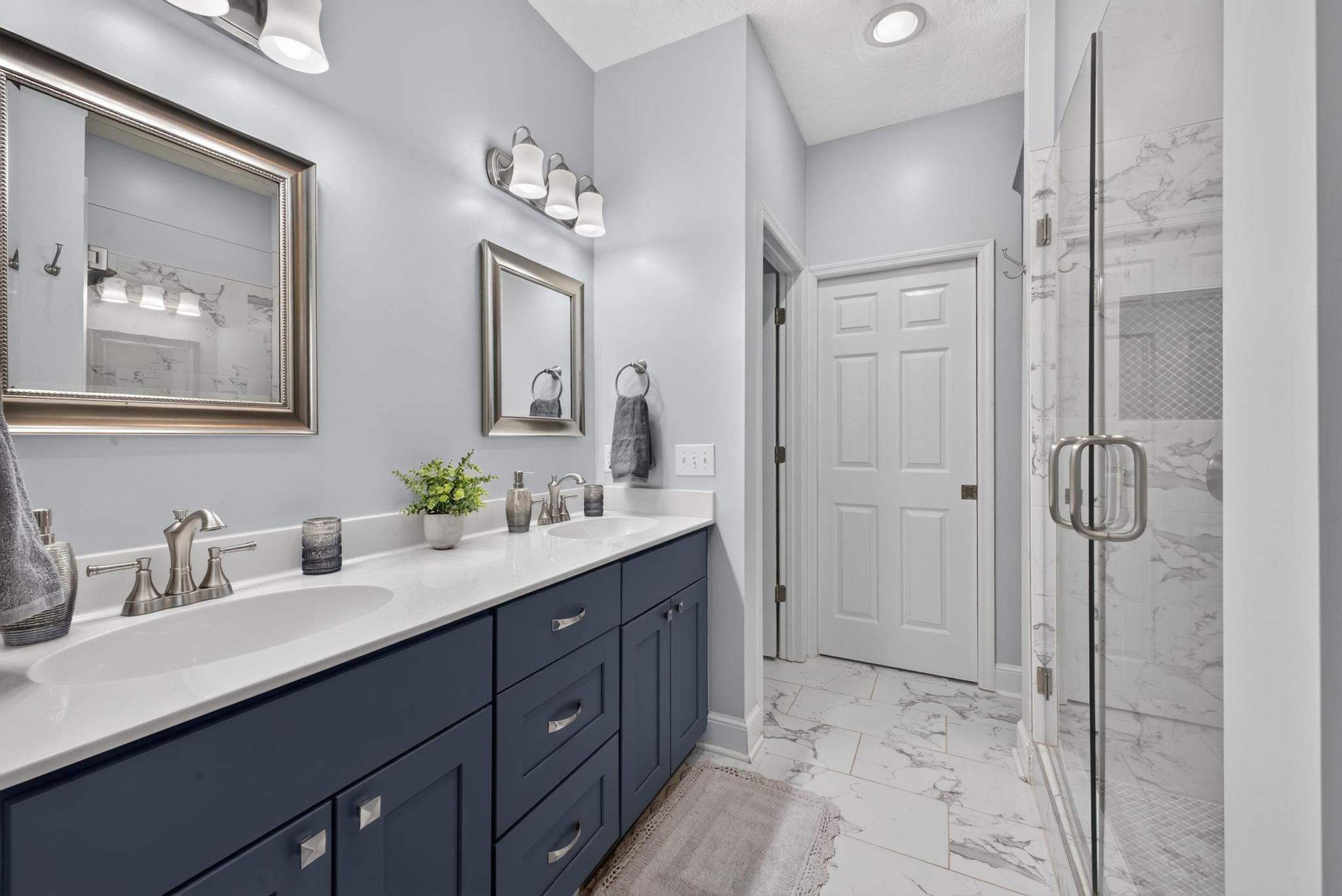 42 Emerald Ridge Aiken, SC 29803 - Photo 20 of 33 a bathroom with a double vanity sink mirror and shower