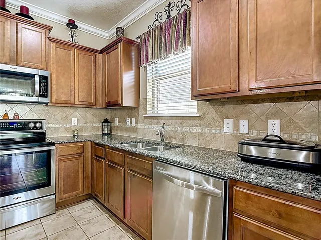 a room with gym equipment and a wooden floor