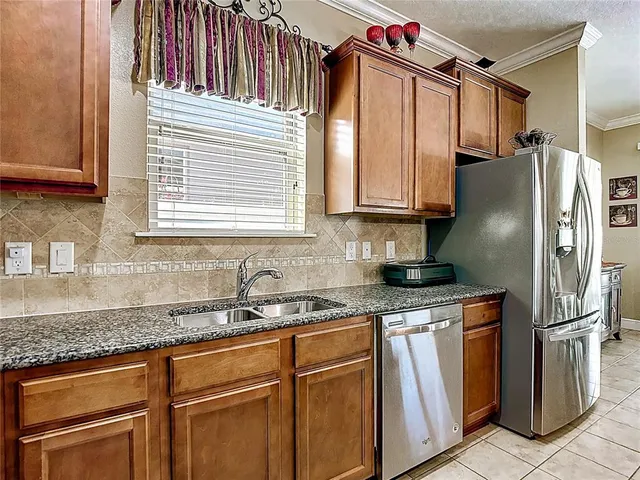 a bedroom with a bed and a desk