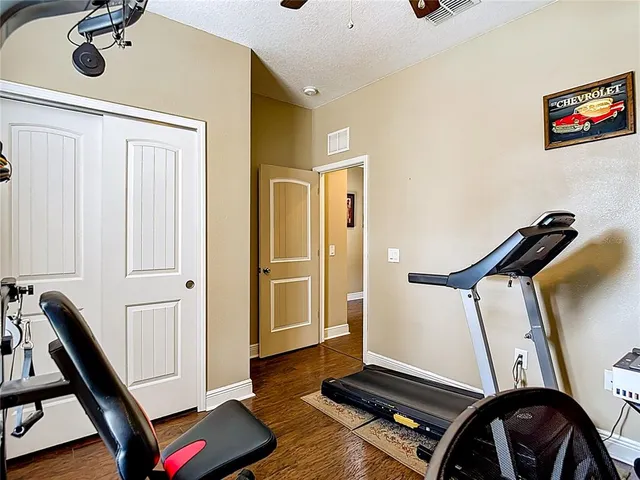 a bed room with a bed and a dresser