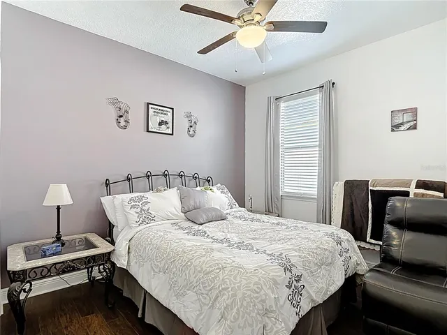 a view of walk in closet with clothes