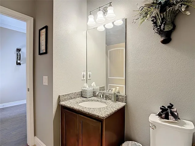 a living room with patio furniture and a large window