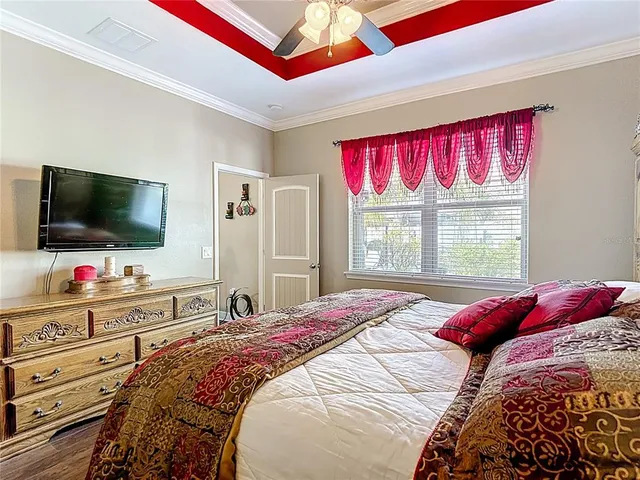 a living room with patio furniture and a potted plant