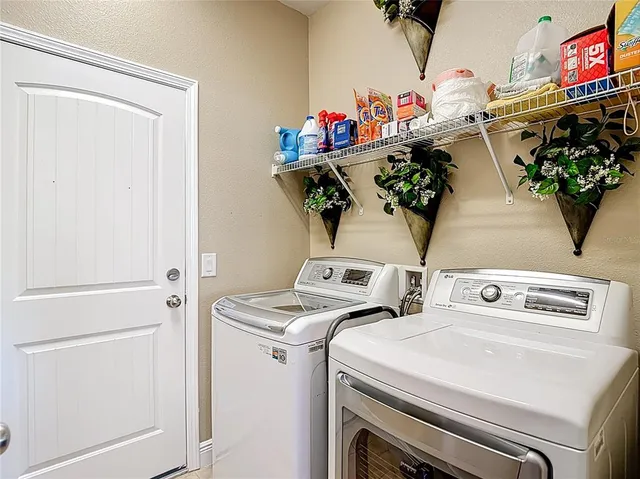 an aerial view of a house with garden space and ocean view