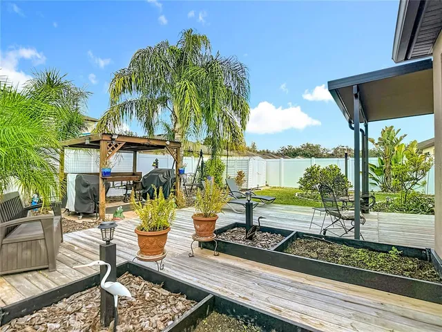 a view of a chairs and table in the patio