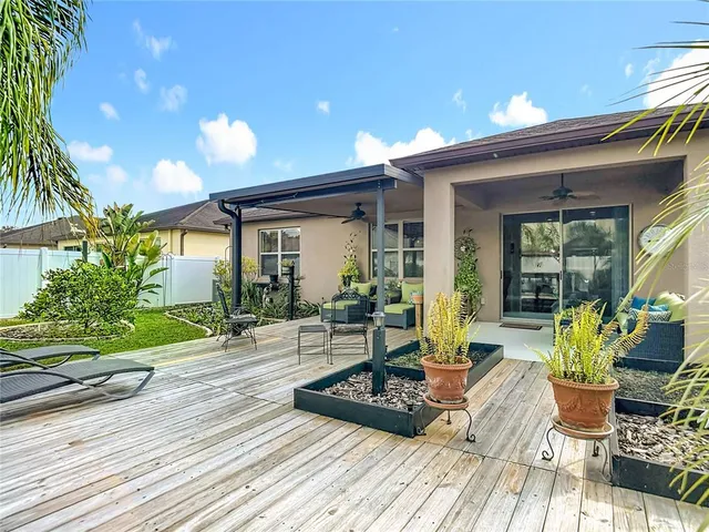 an aerial view of residential houses with outdoor space and street view