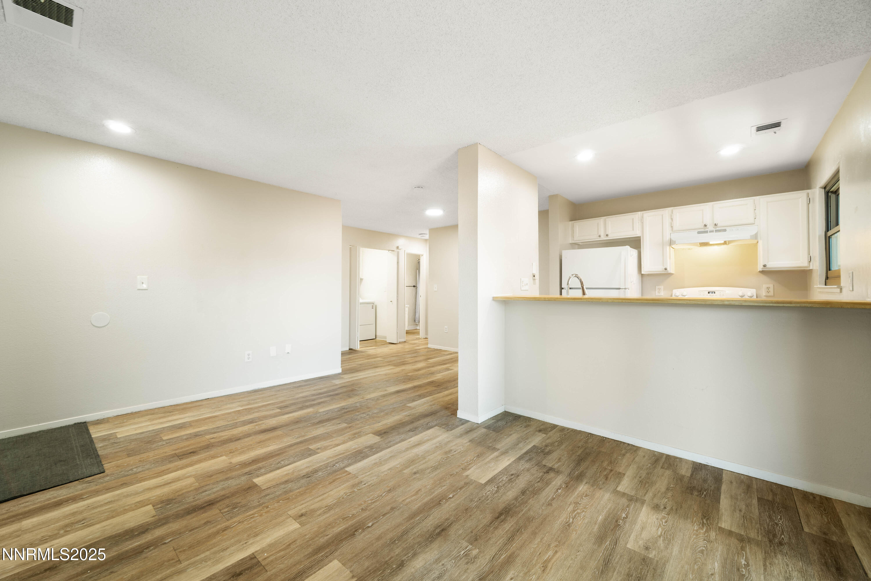 2229 Kietzke Lane, Unit G Reno, NV 89502 - Photo 4 of 9 a view of a kitchen with wooden floor and a sink