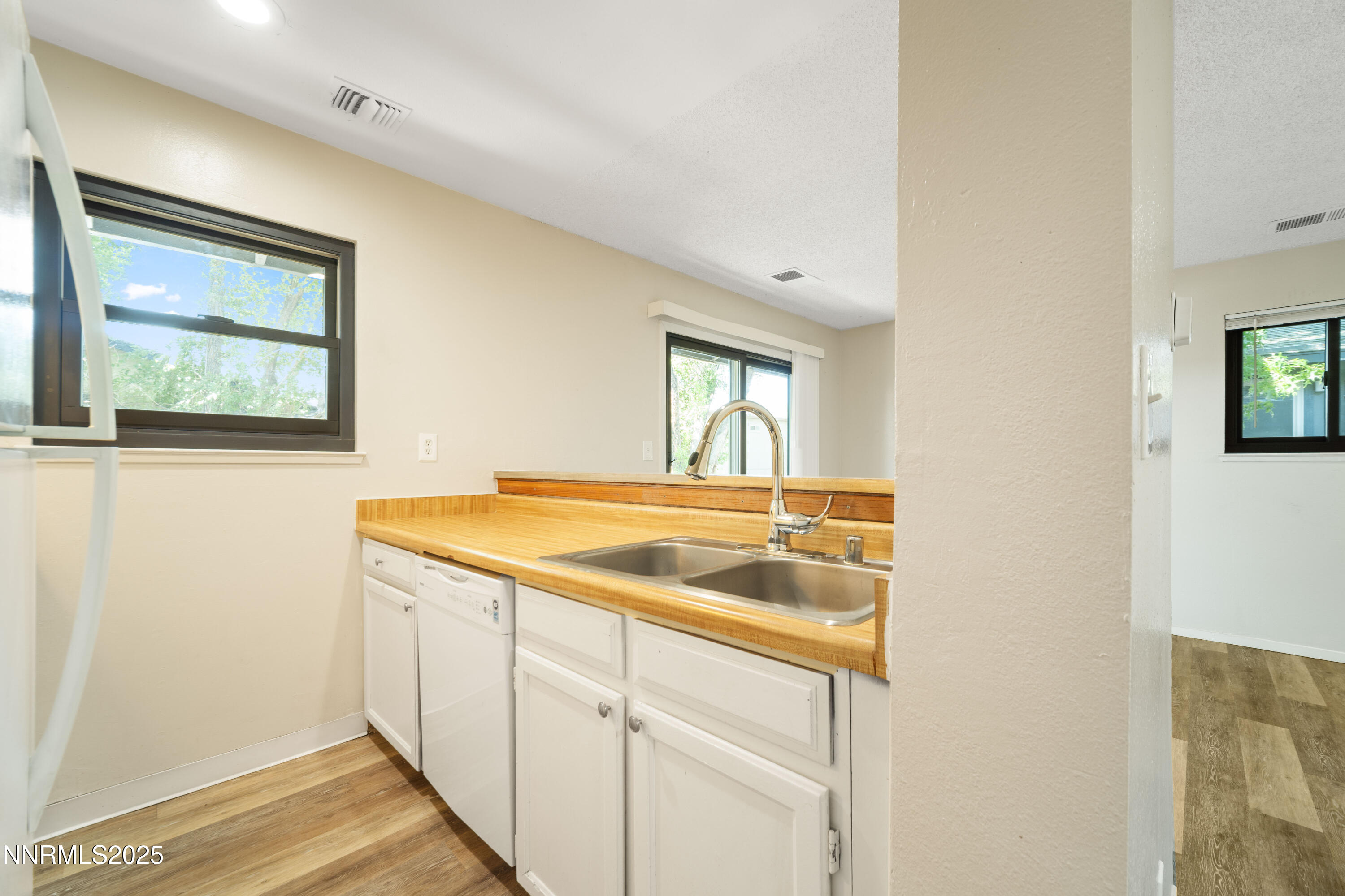 2229 Kietzke Lane, Unit G Reno, NV 89502 - Photo 8 of 9 a kitchen with a sink and cabinets