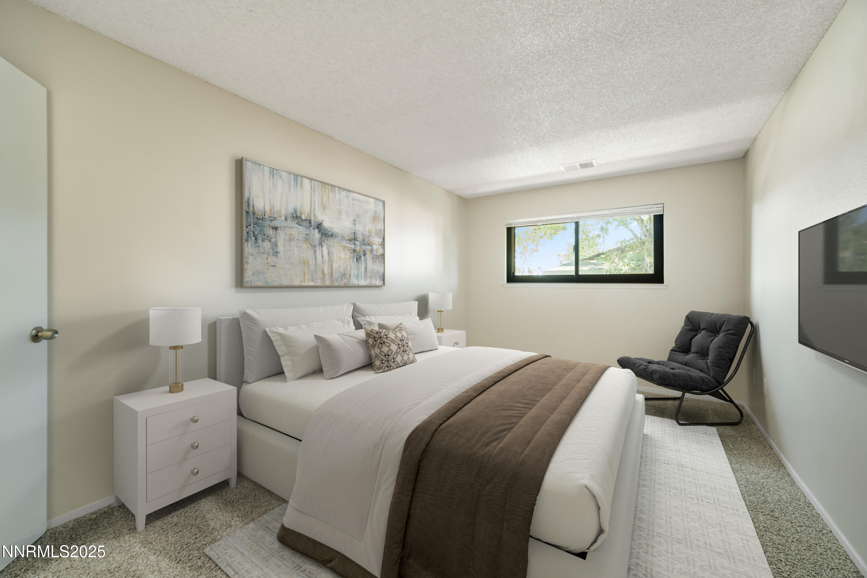 2229 Kietzke Lane, Unit G Reno, NV 89502 - Photo 9 of 9 a bed room with bed and a couch