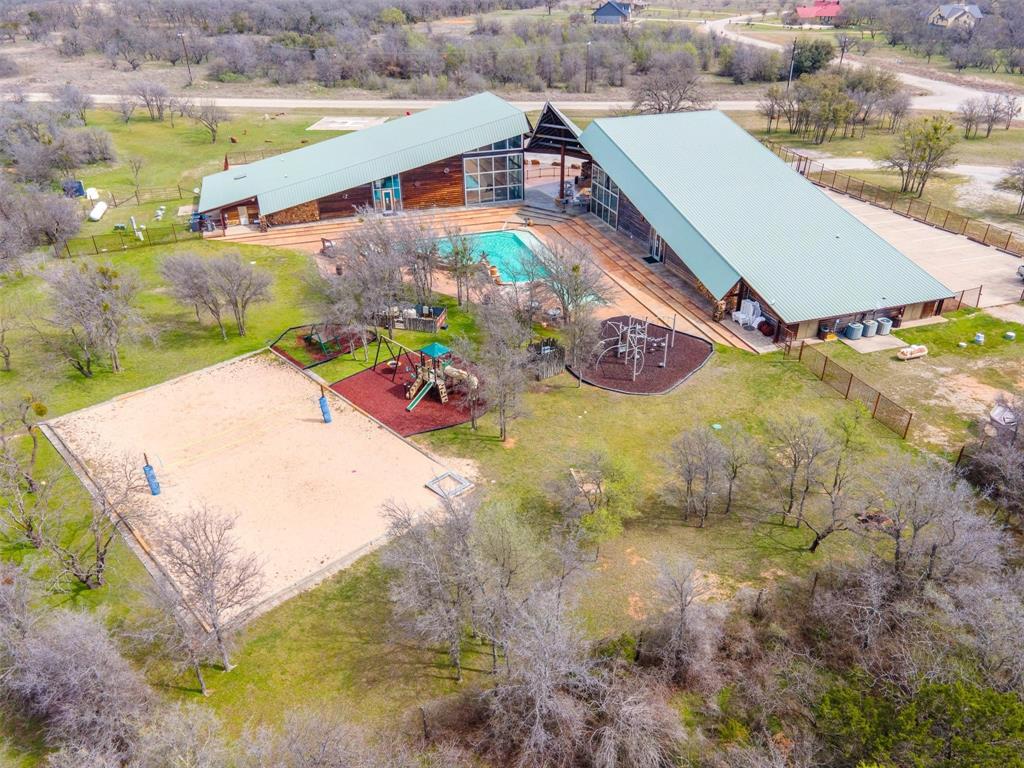E49 R Art's Way Gordon, TX 76453 - Photo 12 of 26 Drone shot highlighting access to Ruff Center amenities including fitness, steam room, hot tub, and resort pool