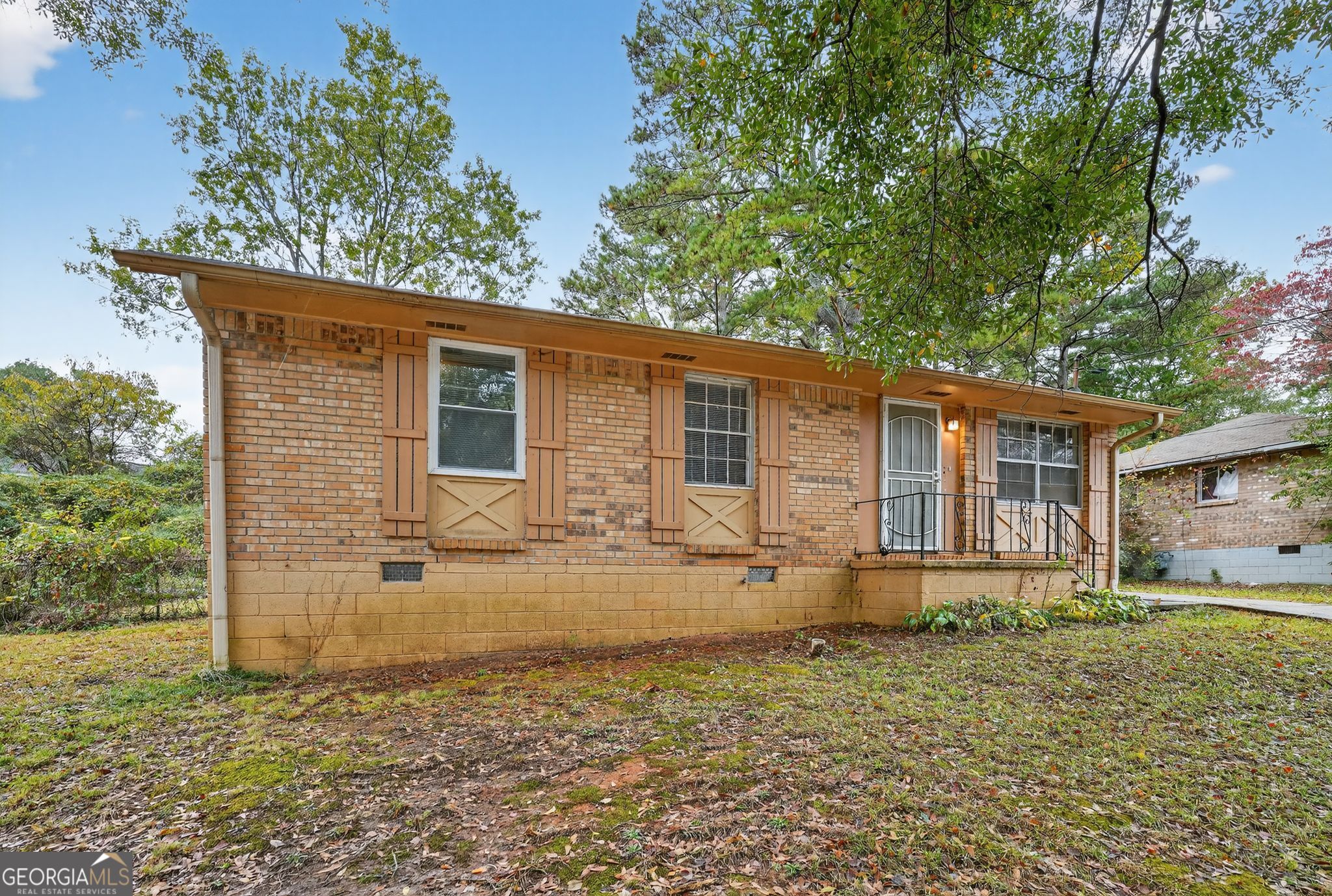 front view of a house with a yard
