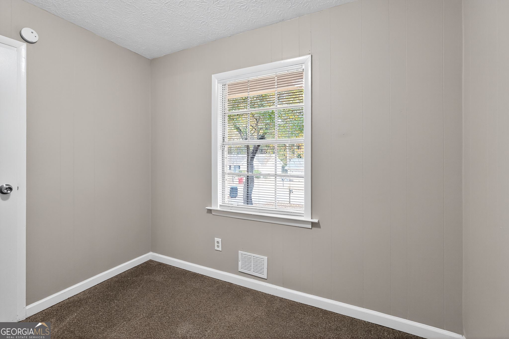 8207 Dunellen Lane Jonesboro, GA 30238 - Photo 20 of 33 an empty room with a window