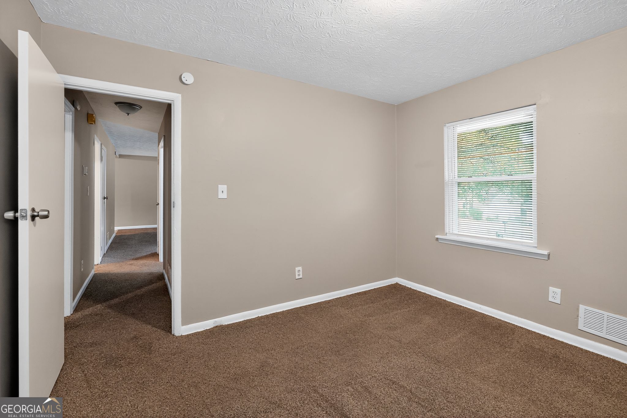 8207 Dunellen Lane Jonesboro, GA 30238 - Photo 23 of 33 an empty room with windows and closet