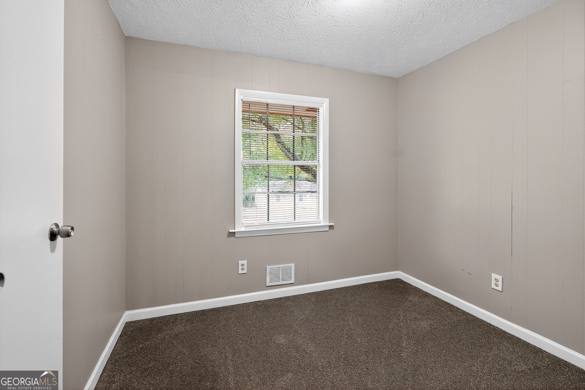 8207 Dunellen Lane Jonesboro, GA 30238 - Photo 26 of 33 a view of an empty room with a window