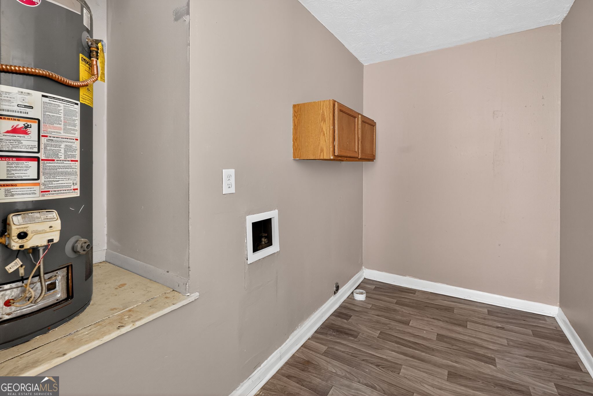 8207 Dunellen Lane Jonesboro, GA 30238 - Photo 30 of 33 a view of a room with wooden floor and closet