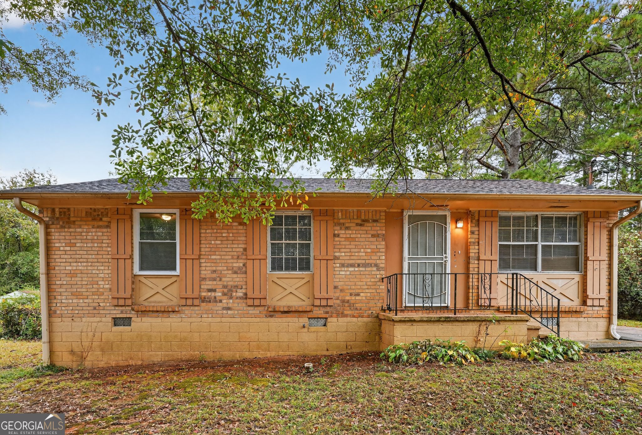 8207 Dunellen Lane Jonesboro, GA 30238 - Photo 3 of 33 front view of a house with a tree