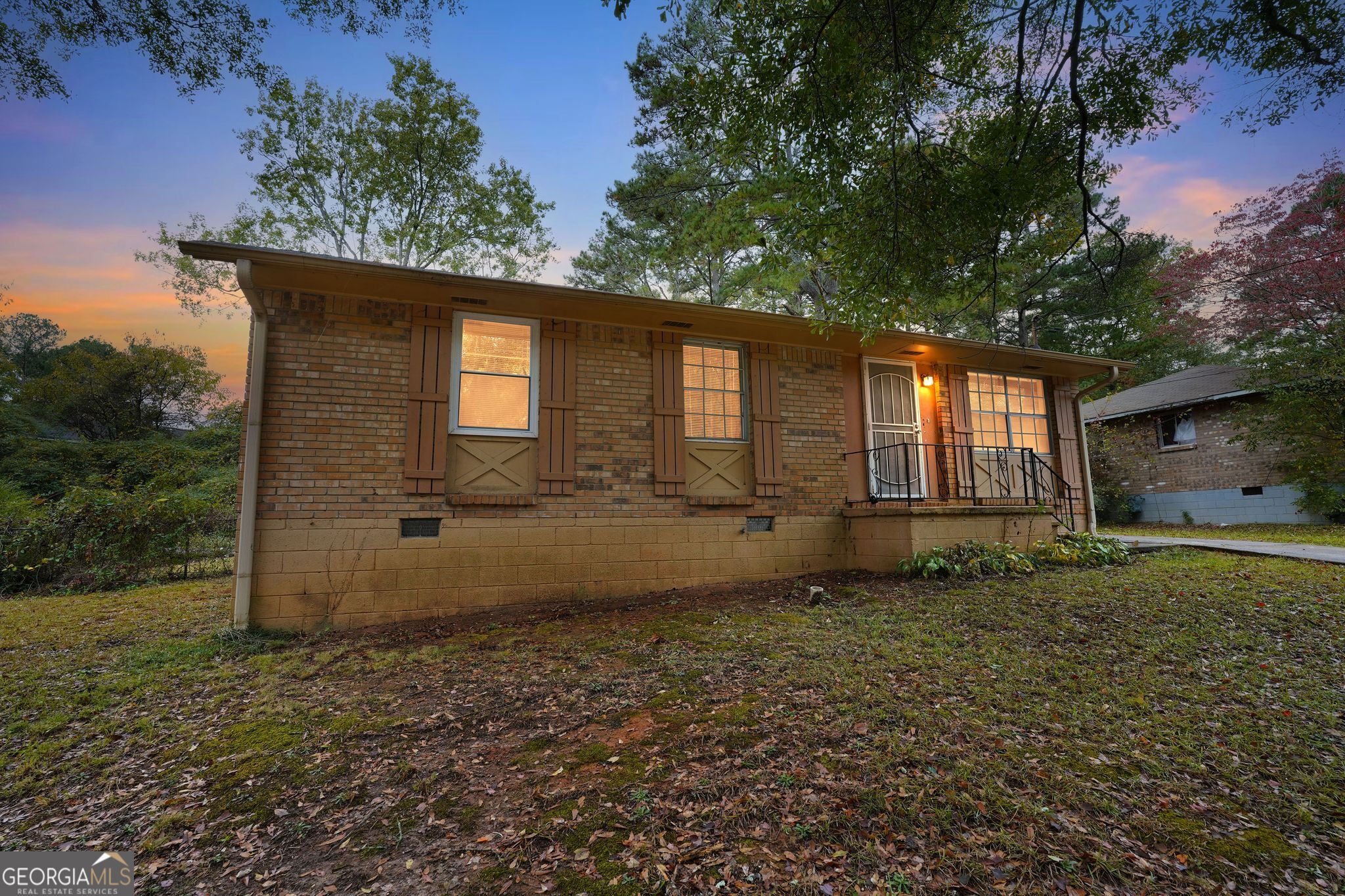 8207 Dunellen Lane Jonesboro, GA 30238 - Photo 31 of 33 a backyard of a house with lots of green space