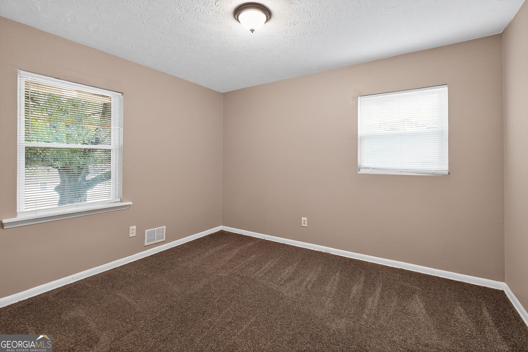 8207 Dunellen Lane Jonesboro, GA 30238 - Photo 8 of 33 an empty room with a window