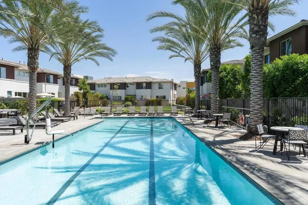 a view of a swimming pool with chairs
