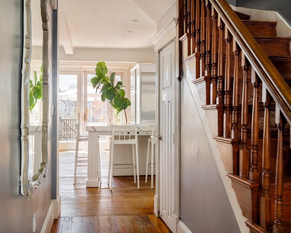 70 Oxford Street Somerville, MA 02143 - Photo 16 of 38 a view of an entryway with wooden floor and stairs