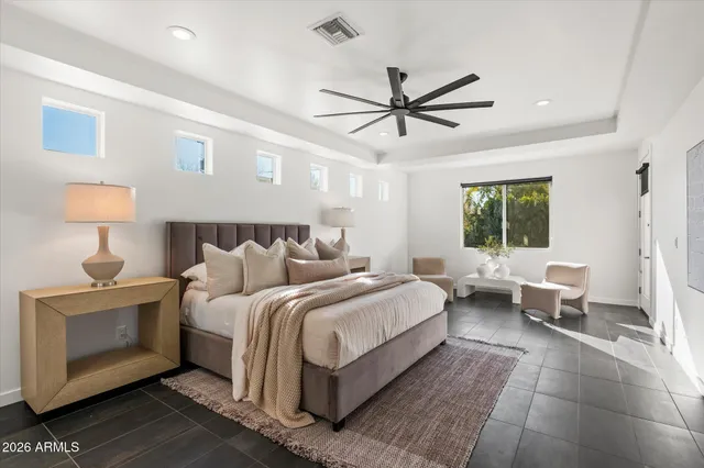 a bed room with a bed and a window