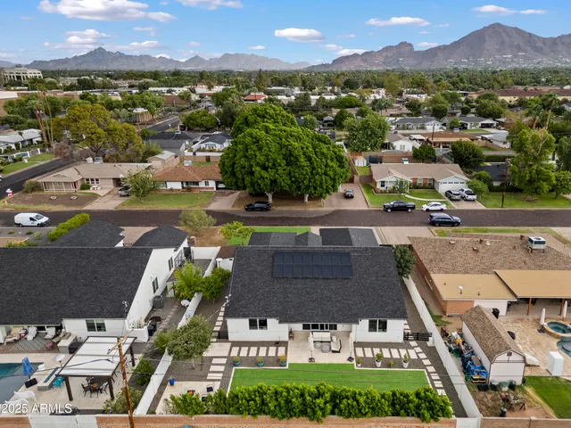 an aerial view of a house with a garden
